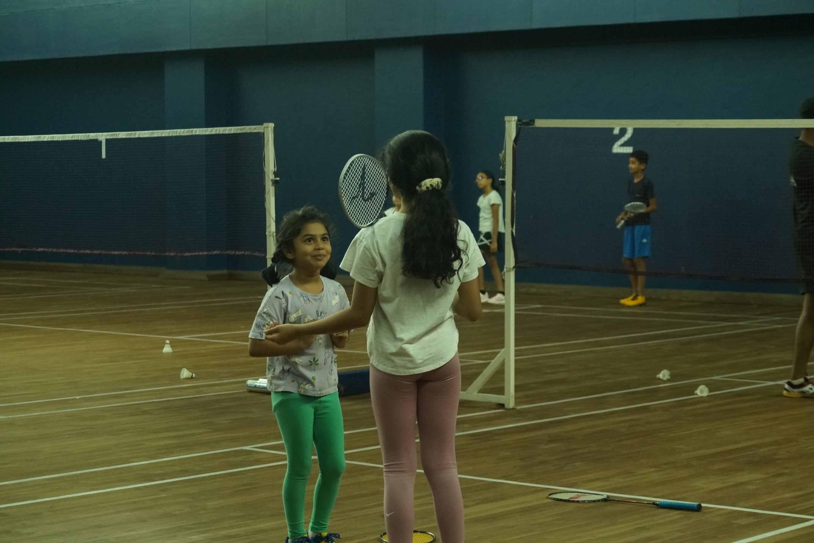 socialization in badminton court for learning teamwork